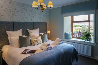 A super-king size bedroom at Macduff House, St Andrews