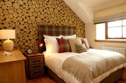 A super king size bedroom at The Clans, Fife