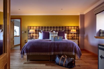 A super king size bedroom at The Clans, Fife