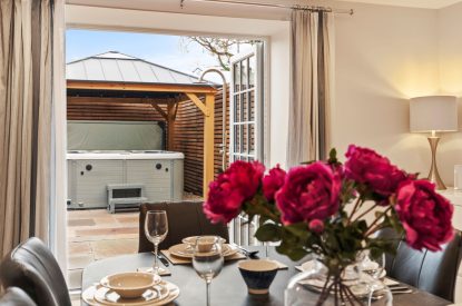 View to the hot tub at The Old School, Oxwich