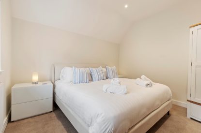 A king size bedroom at The Old School, Oxwich