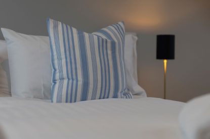 The super king size bedroom at The Little House in Oxwich, Gower