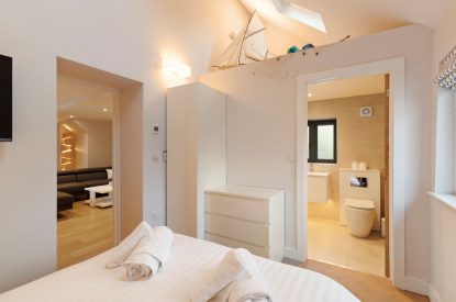 A super king size bedroom at Oxwich Retreat, Gower