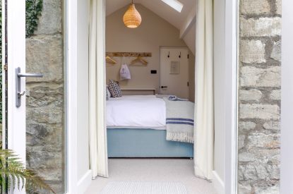 View into a bedroom at The Painswick Retreat, Cotswolds