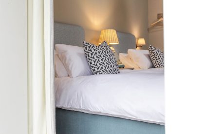 A twin bedroom at The Painswick Retreat, Cotswolds