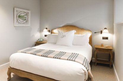 A king size bedroom at The Painswick Retreat, Cotswolds