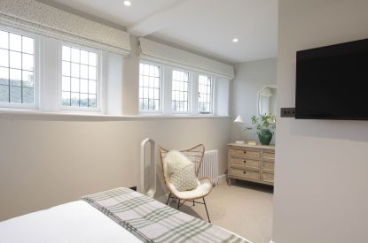 A king size bedroom at The Painswick Retreat, Cotswolds