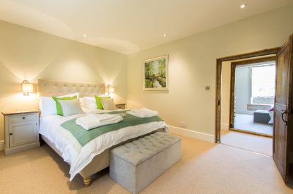 A king size bedroom at Elm Tree Cottage, Somerset