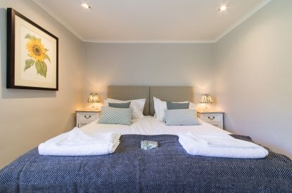A super king sized bedroom at The Creamery, Somerset