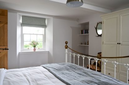A king sized bedroom at Burnside Farmhouse, Perthshire