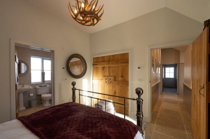 A king sized bedroom at Torran Steading, Perthshire