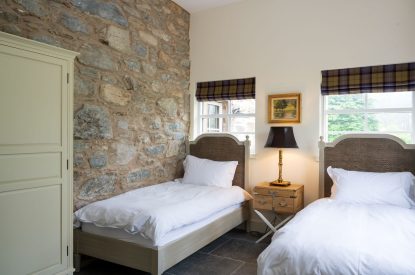 A twin bedroom at The Highland Croft, Perthshire