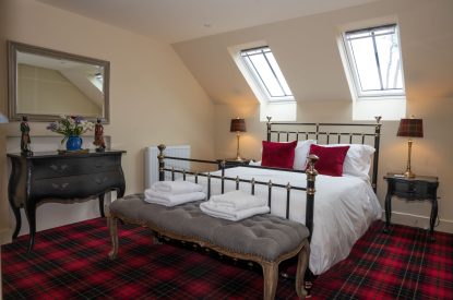 A king sized bedroom at The Highland Croft, Perthshire