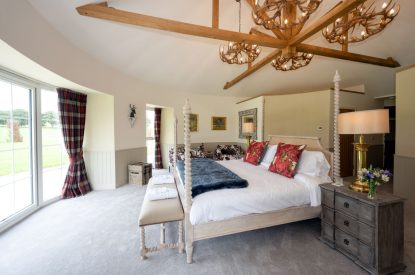 A king sized bedroom at Rowanrigg Steading, Perthshire