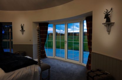 A king sized bedroom at Rowanrigg Steading, Perthshire