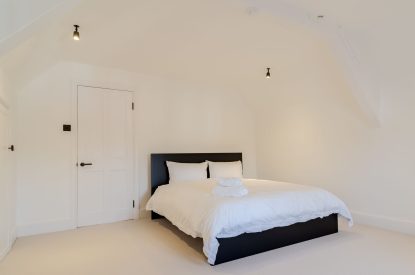 A super king size bedroom at White Exeter House, Devon
