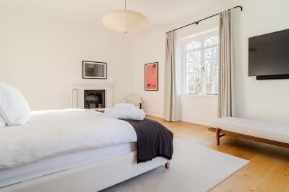 A super king size bedroom at White Exeter House, Devon