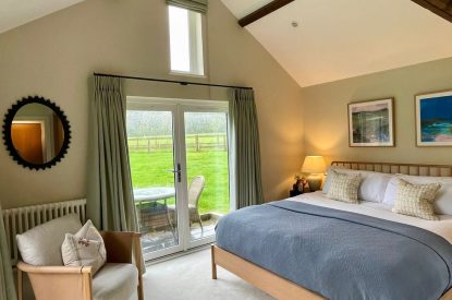 A super-king sized bedroom at Wheatsheaf Barn, Hampshire