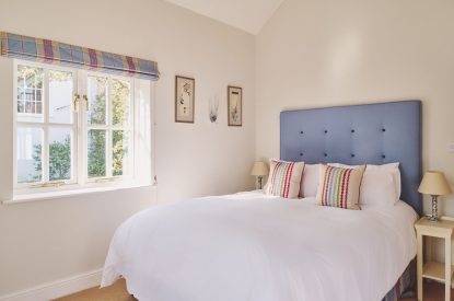 A king sized bedroom at Hockham Pool House, Norfolk Coast