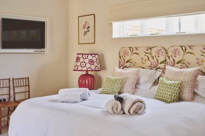 A super king sized bedroom at Hockham Pool House, Norfolk Coast