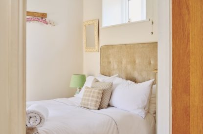 A super king sized bedroom at Hockham Pool House, Norfolk Coast