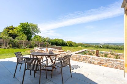 The outdoor dining space at Woodlark, Devon