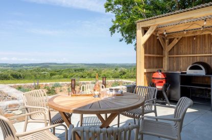 Outdoor dining and kitchen at Woodlark, Devon
