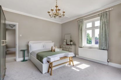 A king sized bedroom at Merry Manor, Essex