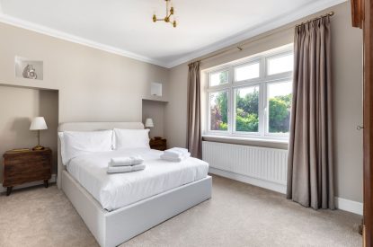 A king sized bedroom at Merry Manor, Essex