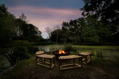 The fire pit at night at Merry Manor, Essex