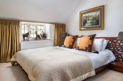 A king sized bedroom at The Old Post Office, Cotswolds
