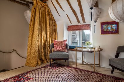 A king sized bedroom at The Old Post Office, Cotswolds