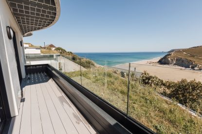 Decking overlooking the beach at Aurora Skies, Cornwall