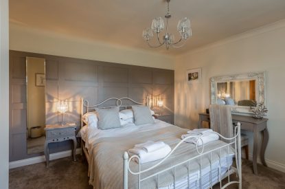 A king sized bedroom at Primrose Cottage, Yorkshire