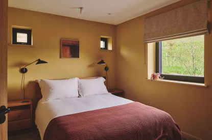 A king size bedroom at Hay Barn, Powys