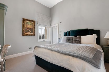 A super-king sized bedroom at Priory West Gate, Essex