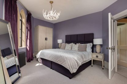 A king size bedroom at Priory Lodge, Essex