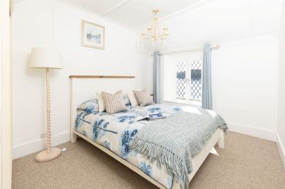 A king size bedroom at Mariner's Cottage, Cornwall