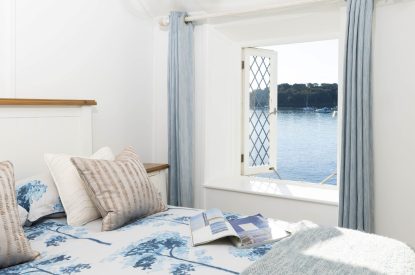 A king size bedroom at Mariner's Cottage, Cornwall
