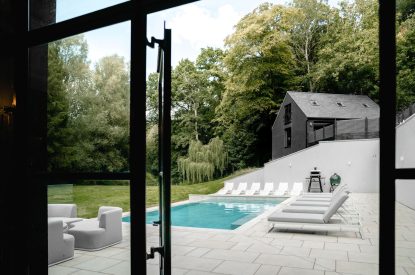 The swimming pool terrace at Halo House, Cotswolds
