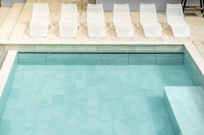 The swimming pool terrace at Halo House, Cotswolds