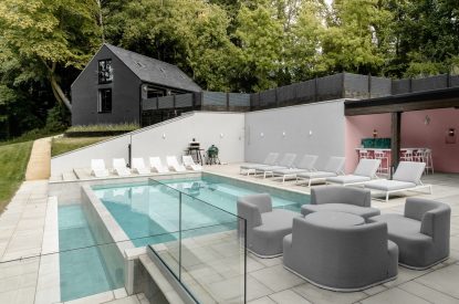 Outdoor seating area and pool at Halo House, Cotswolds