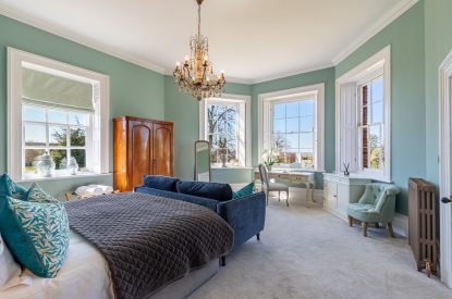 A king-size bedroom at The Priory Estate, Essex