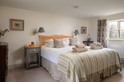 A super king-size bedroom at Buxton Farmhouse, Norfolk