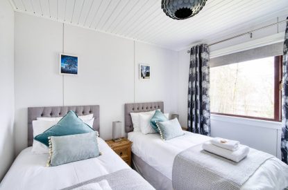 A twin bedroom at Ben More Cabin, Loch Lomond