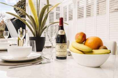 The dining table with a fruit bowl at Rose Cottage, Isle of Wight