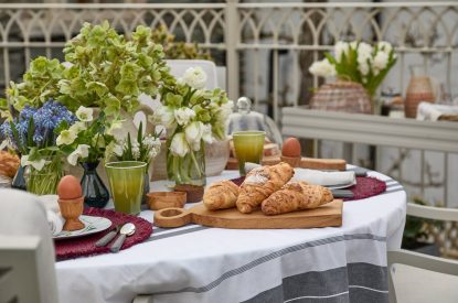 The outdoor dining table with breakfast at Beatrix Cottage, Lake District