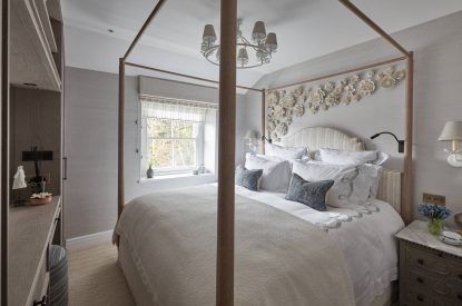A bedroom with four poster bed at Beatrix Cottage, Lake District