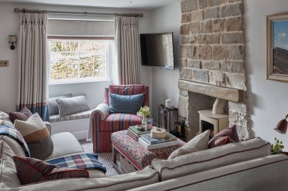 The living room with log burner at Beatrix Cottage, Lake District