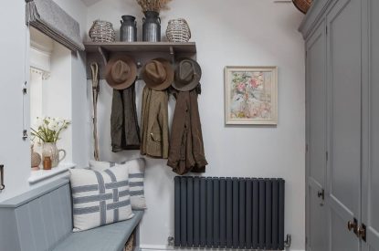 A utility room with bench seat at Beatrix Cottage, Lake District